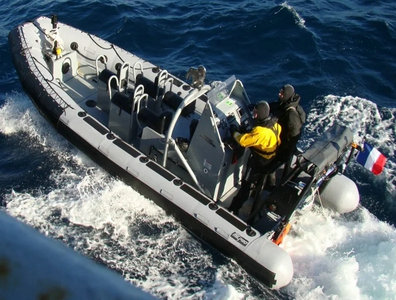 military rib boat with searching light